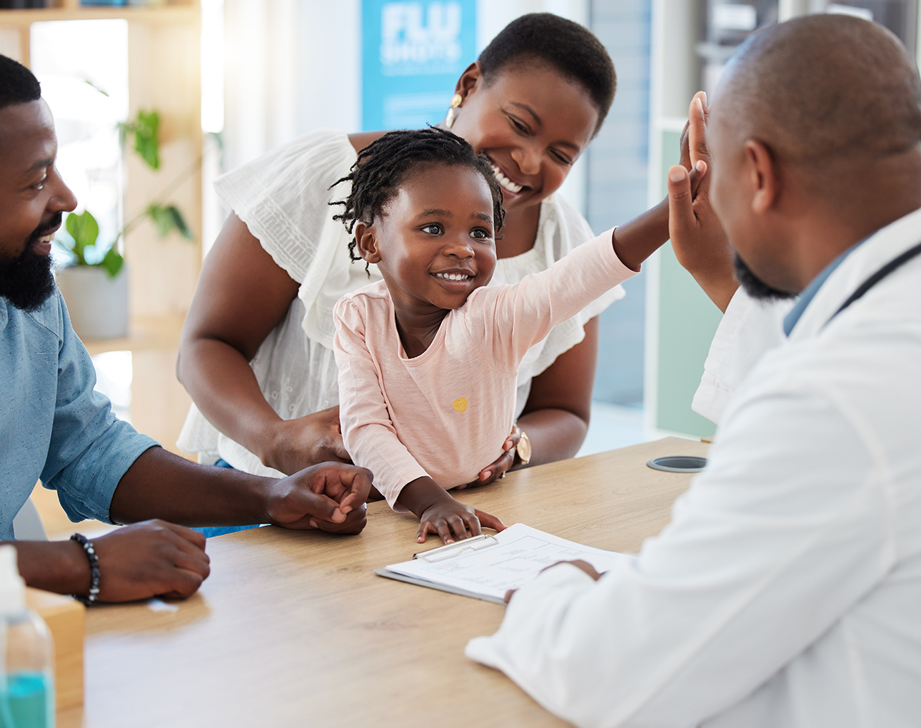 Family at a table receiving assistance