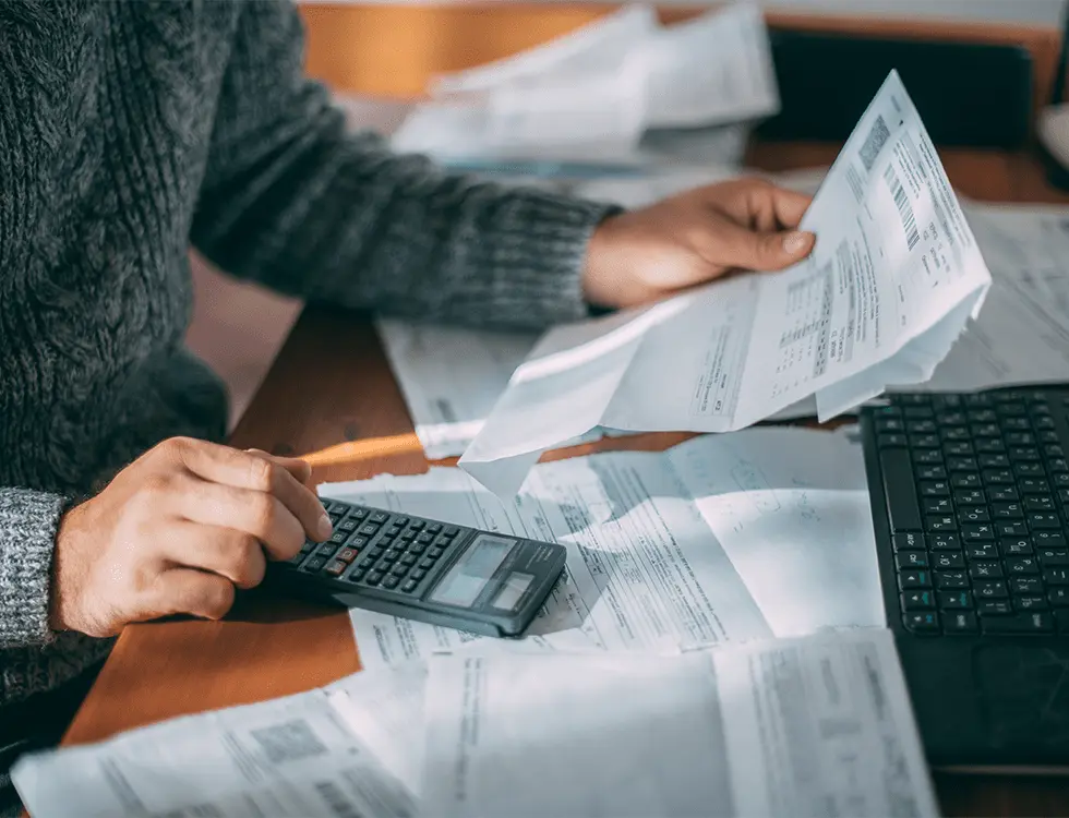 Close up of paperwork and calculator