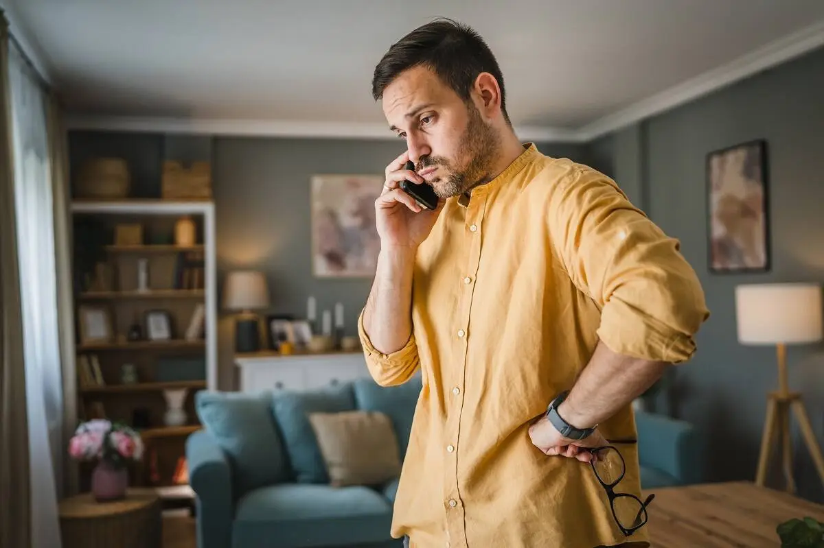 Worried man on the phone