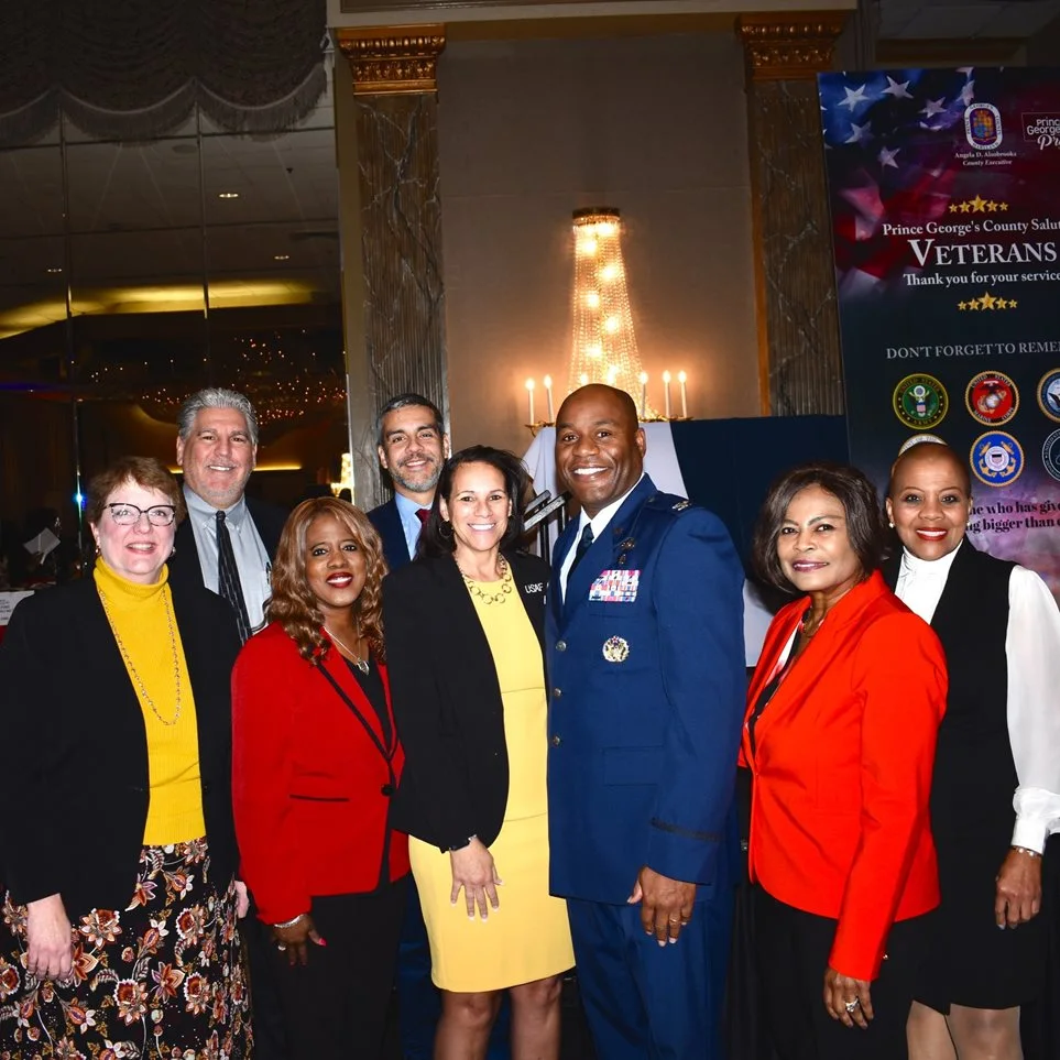 Team Andrews standing with military member