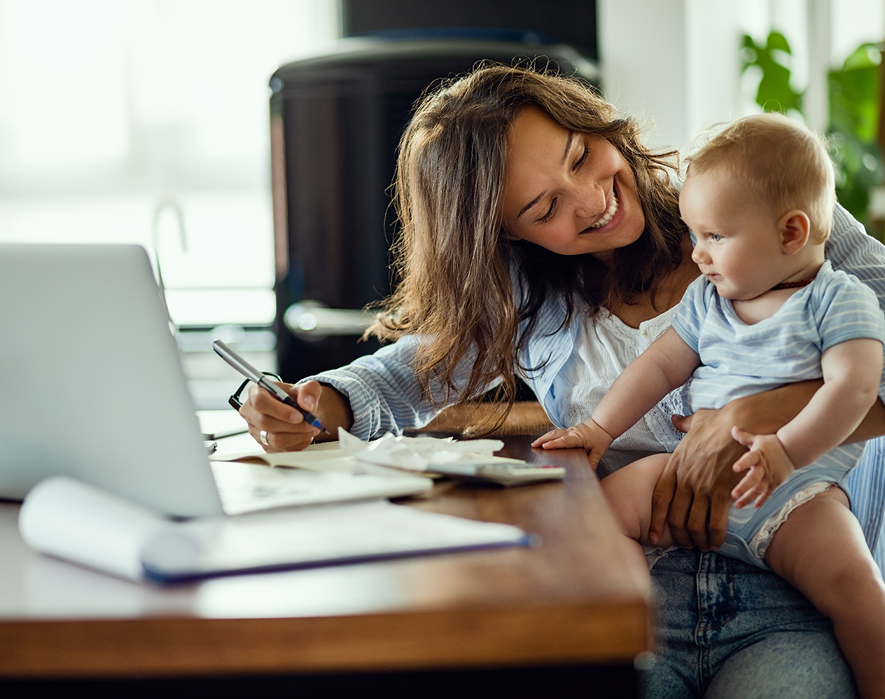 Woman and baby at a computer