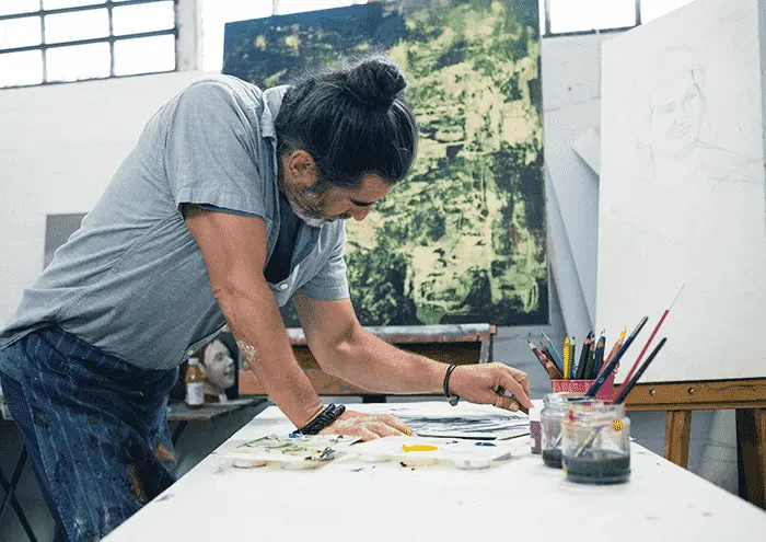 Artist in studio sketching