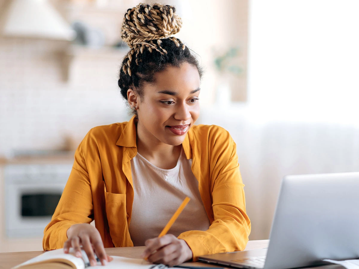 Woman smiling filling out a form