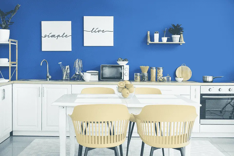 Clean kitchen featuring a dining room table and chairs